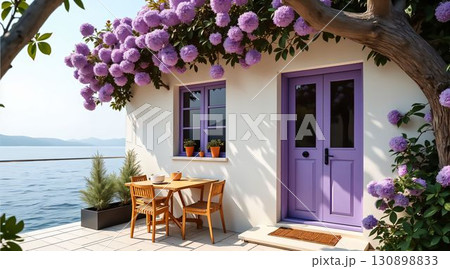 Charming waterfront cottage adorned with purple flowers and a cozy dining setup by the water 130898833