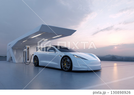 A luxury white electric car is fast charging in a parking lot on the roof of a building. Electric car with a view of the sky. 130898926