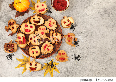 Scary ghost cookies,ghosts and pumpkins on old concrete background,cafe advertisement and menu,restaurant business card,Halloween food concept,idea for cooking holiday dishes for kids and adults. Scary ghost cookies,ghosts and pumpkins on old concrete background,cafe advertisement and menu,restaurant business card,Halloween food concept,idea for cooking holiday dishes for kids and adults. 130899368