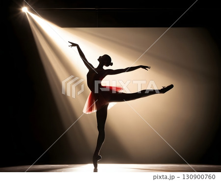 Silhouette of ballerina in graceful dance pose with glowing spotlight, cinematic elegant stage scene 130900760