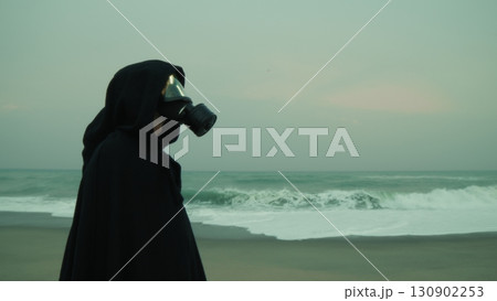 After a Nuclear Bomb, a Man Stands on a Deserted Beach Near Polluted Ocean 130902253