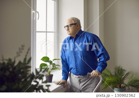 Portrait of pensive senior man looking at window 130902362