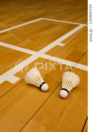 Close-up of the shuttlecocks in the badminton court, sports centre. Sports and recreation concept. Close-up of the shuttlecocks in the badminton court, sports centre. Sports and recreation concept. 130906359