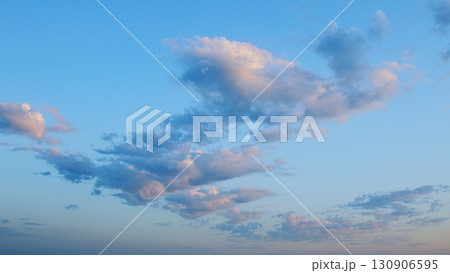 A Beautiful Serene Cloudscape at Dusk with a Soft Blue Sky That Evokes Peacefulness and Calmness 130906595