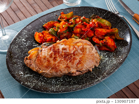 Grilled veal steak with braised vegetables Grilled veal steak with braised vegetables 130907197