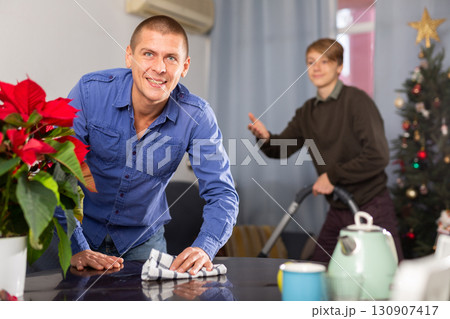 Man and his son communication during housekeeping before New Year Man and his son communication during housekeeping before New Year 130907417