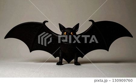 Matte Black Bat Sculpture with Gold Eyes. Hallowen Concept. Generated Image 130909760