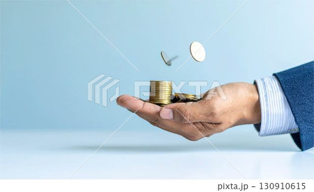 成長する富。積み重ねられたコインと、最後に一枚を置く手。ビジネスの成功、金融、投資、貯蓄のコンセプト 成長する富。積み重ねられたコインと、最後に一枚を置く手。ビジネスの成功、金融、投資、貯蓄のコンセプト 130910615