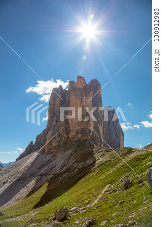 Bright Sun over the Peaks of Tre Cime di Lavaredo 130912983