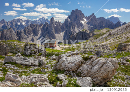 Dolomites and a Tourist Refuge in a Rocky Valley 130912986