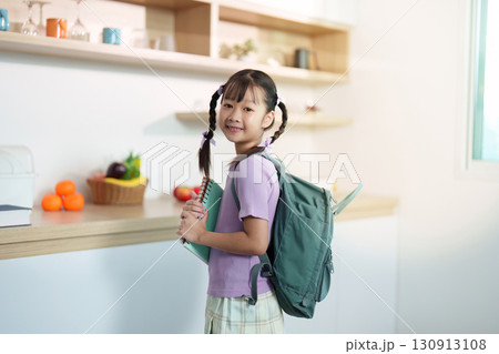 Back to School. Smiling girl with backpack ready to leave for school. Back to School. Smiling girl with backpack ready to leave for school. 130913108