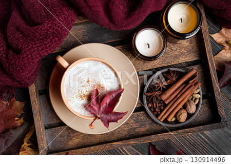 Cozy autumn composition with coffee, plaid and maple leaves Cozy autumn composition with coffee, plaid and maple leaves 130914496