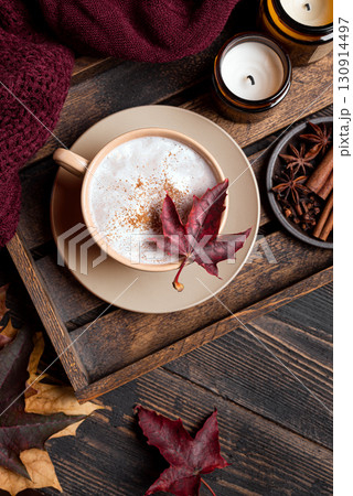 Cozy autumn composition with coffee, plaid and maple leaves 130914497