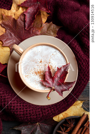 Cozy autumn composition with coffee, plaid and maple leaves Cozy autumn composition with coffee, plaid and maple leaves 130914516