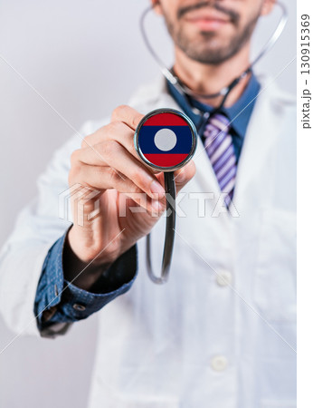 Laos health and medical insurance concept. Laos healthcare system, doctor holding stethoscope Laos health and medical insurance concept. Laos healthcare system, doctor holding stethoscope 130915369