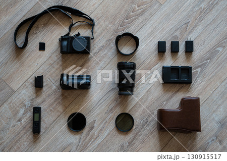Flat lay of photography equipment on wooden floor Flat lay of photography equipment on wooden floor 130915517