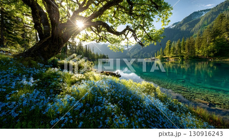 A serene lake reflects a bright sky behind a tree with wildflowers. A serene lake reflects a bright sky behind a tree with wildflowers. 130916243