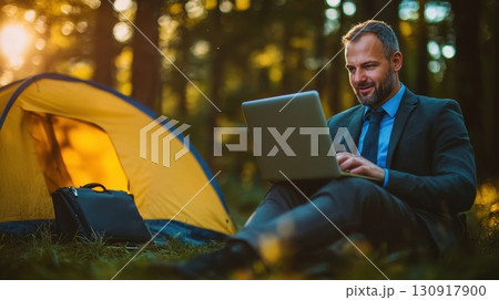 Man works remotely in nature. 130917900