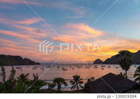 Taiohae Bay at sunset with sailboats in Nuku Hiva, Marquesas Islands, French Polynesia 130919304