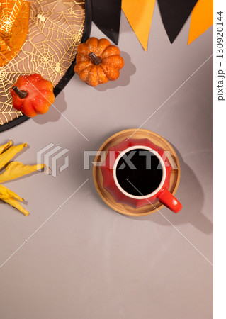 Enjoying Coffee During Thanksgiving Holiday With Halloween Decorations 130920144
