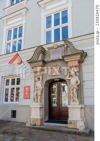 Poland, Krakow, Facade of the Cervantes Institute with the Spanish flag 130920470