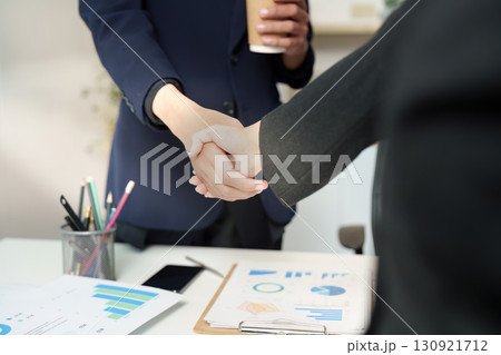 Business Agreement. Professionals shaking hands after a successful meeting. Business Agreement. Professionals shaking hands after a successful meeting. 130921712