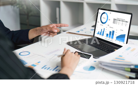 Data Analysis and Reporting. Business professional analyzing financial charts on laptop. Data Analysis and Reporting. Business professional analyzing financial charts on laptop. 130921718