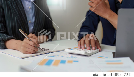 Financial Consultation. Professionals calculating expenses and planning budgets. Financial Consultation. Professionals calculating expenses and planning budgets. 130921721