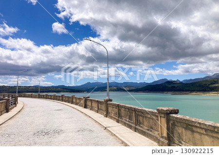 Los Bermejales Reservoir is a tranquil body of water surrounded by scenic natural landscapes and pine forests in the province of Granada, Spain 130922215