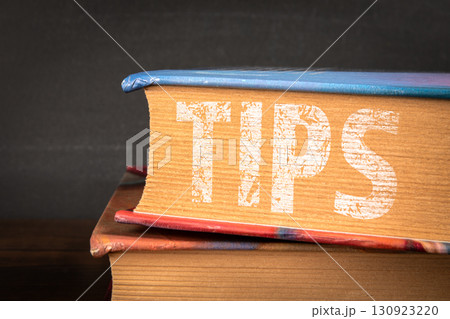 Close up of book spine with tips text 130923220