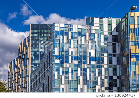 Contemporary Urban Architecture. Reflective Windows and Abstract Geometric Exterior 130924417
