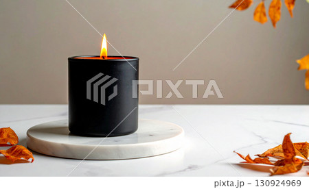 Matte Black Candle with Orange Flame on Marble Tray. Hallowen Concept. Generated Image 130924969