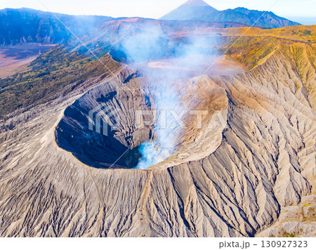 Aerial view Mountains at Bromo volcano during sunrise sky,Beautiful Mountains Penanjakan in Bromo Tengger Semeru National Park,East Java,Indonesia.Nature landscape background Aerial view Mountains at Bromo volcano during sunrise sky,Beautiful Mountains Penanjakan in Bromo Tengger Semeru National Park,East Java,Indonesia.Nature landscape background 130927323