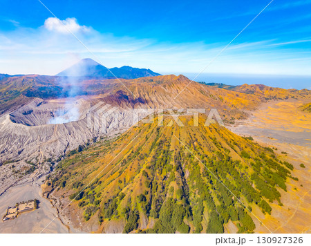 Aerial view Mountains at Bromo volcano during sunrise sky,Beautiful Mountains Penanjakan in Bromo Tengger Semeru National Park,East Java,Indonesia.Nature landscape background Aerial view Mountains at Bromo volcano during sunrise sky,Beautiful Mountains Penanjakan in Bromo Tengger Semeru National Park,East Java,Indonesia.Nature landscape background 130927326