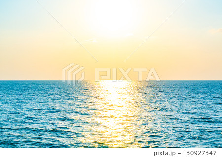Aerial view Beautiful view sunset over sea surface beautiful wave Amazing light sunset or sunrise sky over sea beach with wave crashing in the ocean.nature background Aerial view Beautiful view sunset over sea surface beautiful wave Amazing light sunset or sunrise sky over sea beach with wave crashing in the ocean.nature background 130927347