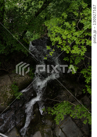 A small river in the forest between the rocks, Georgia 130927587