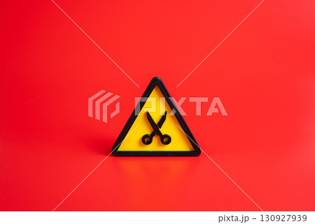 Scissors symbol. Concept of budget cutting or time reduction. Dismissal, layoffs. Used for austerity measures, cost reduction, unemployment, crisis management, and policy changes. Scissors symbol. Concept of budget cutting or time reduction. Dismissal, layoffs. Used for austerity measures, cost reduction, unemployment, crisis management, and policy changes. 130927939