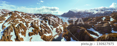 Mountain landscape in summer. Aerial view at glacier melted lake, mountains ridge, and highway. Nature park in Sauda municipality, Rogaland fylke. Beautiful nature of Norway. Horizontal banner 130927975
