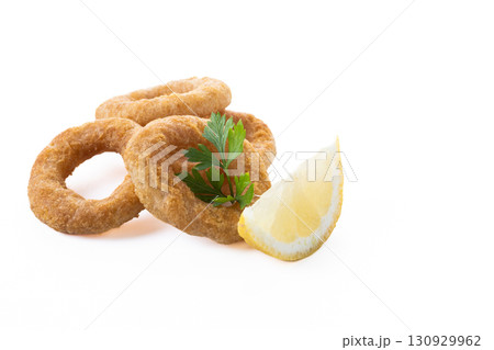 Crispy fried squid rings isolated on white background Crispy fried squid rings isolated on white background 130929962