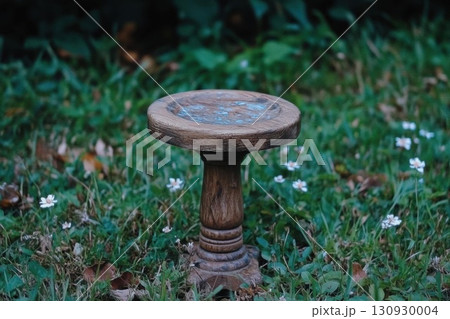 Rustic bird bath with garden scene. Rustic bird bath with garden scene. 130930004