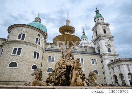 Residenzbrunnen fountain and Salzburg Cathedral (Salzburger Dom) Roman Catholic Baroque cathedral in Salzburg, Austria 130930702