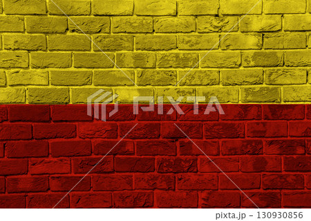 The official flag of the capital of the Czech Republic, Prague, on a brick wall texture. Conceptual collage 130930856