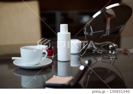 Modern Vanity Scene with Makeup and Coffee Essentials Modern Vanity Scene with Makeup and Coffee Essentials 130931340