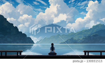 Girl sitting cross-legged on a dock by a mountain lake, gazing at the clouds and the vast landscape 130931513