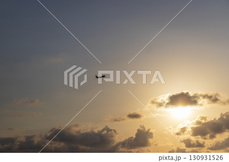 Airplane that just took of to the beautiful sunset sky Airplane that just took of to the beautiful sunset sky 130931526