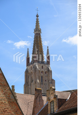 Tower of the Church of Our Lady Roman Catholic gothic church in Bruges, Belgium 130931694