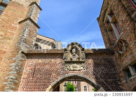 Detail on the facade of the Church of Our Lady Roman Catholic gothic church in Bruges, Belgium 130931697