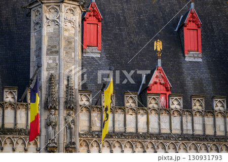 Roof and facade details on historic Bruges City Hall building on Burg Square in Bruges, West Flanders, Belgium Roof and facade details on historic Bruges City Hall building on Burg Square in Bruges, West Flanders, Belgium 130931793