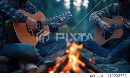 Hippies Playing Acoustic Guitars Around A Campfire 130932773