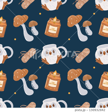 A warm and cozy autumnal seamless pattern. Yarn, scented candles, mushrooms, and a cute mug with an owl. A colorful background with autumnal elements and attributes. Autumn pattern. Vector 130932842